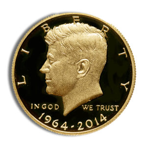 Close-up of a gold commemorative coin featuring a left-facing JFK bust, LIBERTY at the top, IN GOD WE TRUST, 1964–2014.