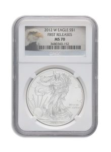Close-up of a graded 2012-W American Silver Eagle $1 coin in a plastic slab; label reads 'FIRST RELEASES MS70'.