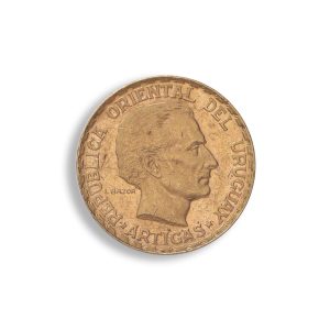 Copper coin featuring a left-facing portrait of José Artigas, surrounded by the inscription 'REPUBLICA ORIENTAL DEL URUGUAY ARTIGAS'