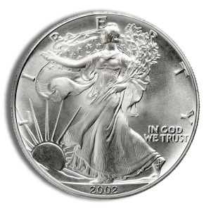Close-up of a 2002 Walking Liberty silver coin, showing Lady Liberty walking toward the sun with 'IN GOD WE TRUST' and the year 2002.