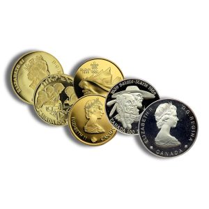 Assorted Canadian coins in gold and silver tones arranged in a curved line, showcasing Queen Elizabeth II portraits and various designs.