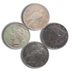 Five worn US coins arranged in a circular pattern, showing Liberty profile on each coin? front sides visible on white background.