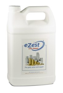 White plastic one-gallon jug labeled 'e-Zest coin cleaner' for cleaning gold, silver, and copper coins.
